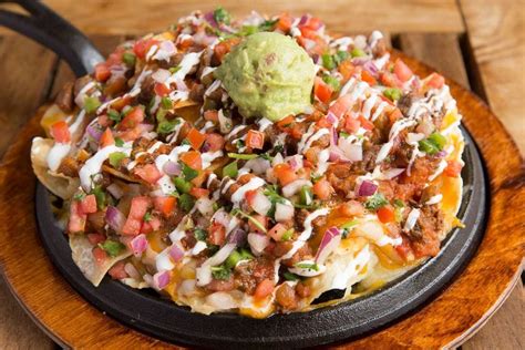 Nacho daddy las vegas - Corn chips & chicken breast smothered & baked in ranchero sauce, melted cheese & sour cream. Served with two eggs any style, refried beans, guacamole, salsa & pico de gallo. BOTTOMLESS MIMOSAS & BLOODY MARY’S.